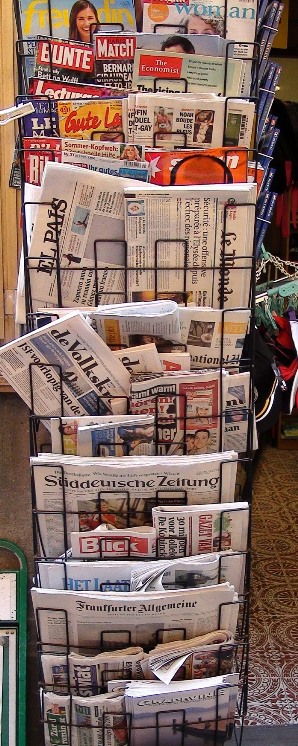 a rack of Europen popular magazines for sale